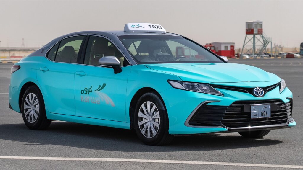 Karwa taxi parked near Hamad International Airport in Doha, Qatar