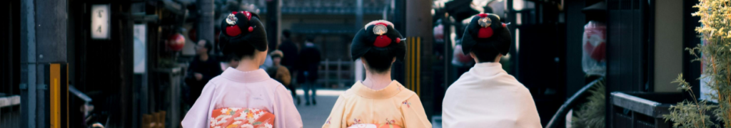 Three Woman Wearing Traditional Dresses Walking On Street Gion Kyoto