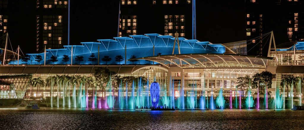 Spectra light beams and water mist in front of The Shoppes at Spectra Marina Bay Sands